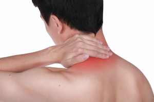 Close up suffering male pain in neck isolated white background.