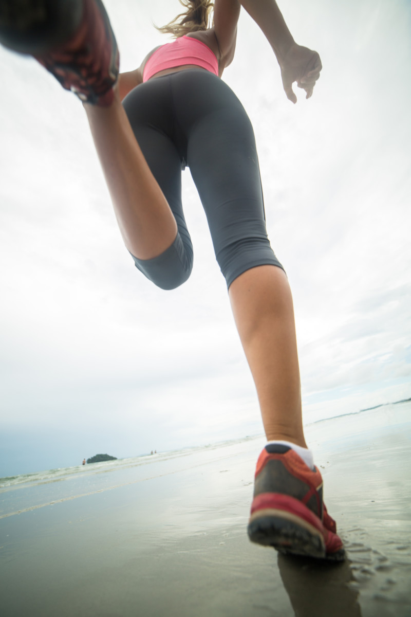 running on beach in the rain