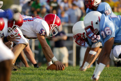 Teens Playing Scrimmage on the Football field, Randals Island